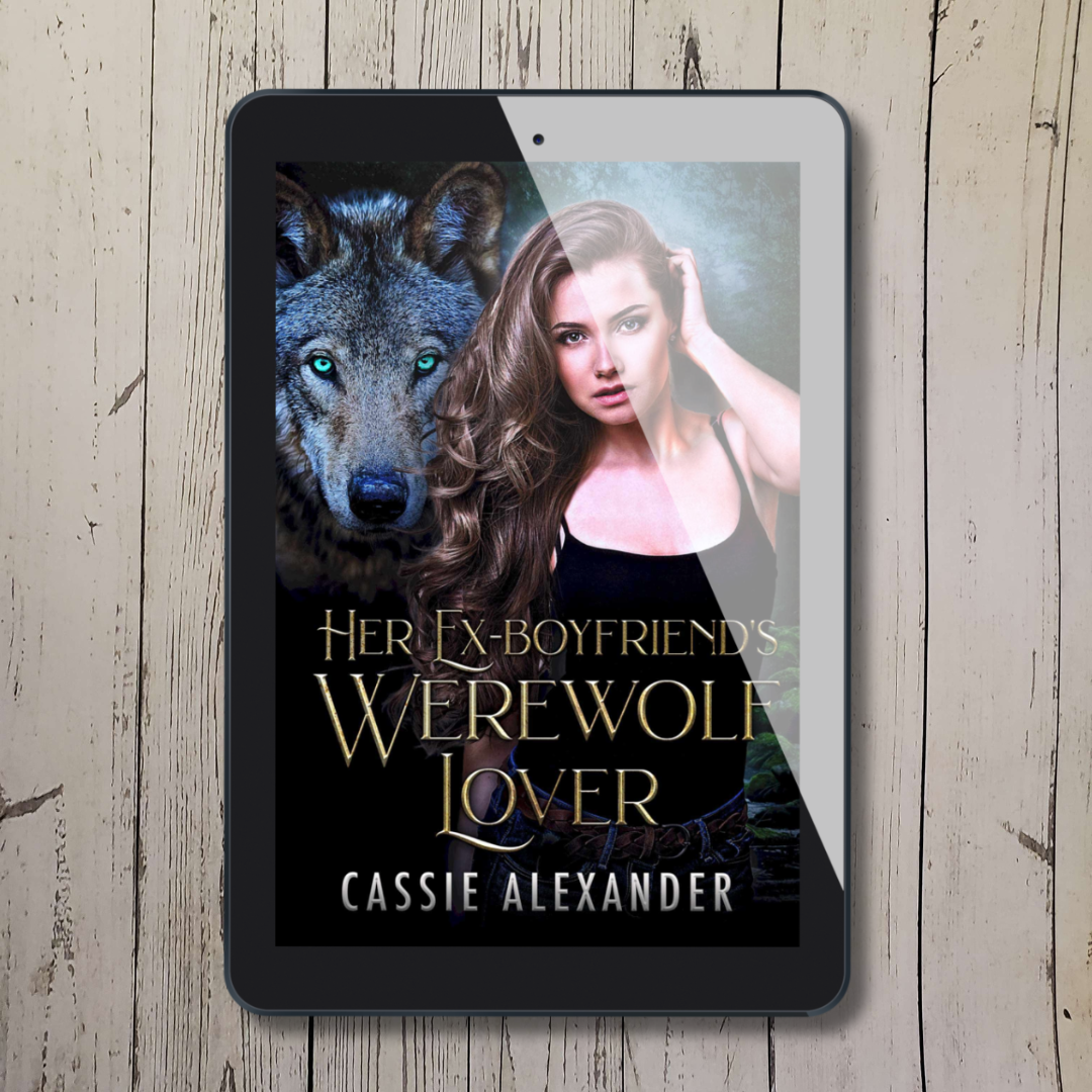 Tablet showing cover of "Her Ex-Boyfriend's Werewolf Lover" by Cassie Alexander with a brunette woman and a large wolf in the background.