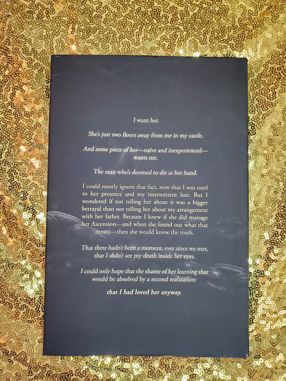 Hardcover of Break Her by Cassie Alexander on a gold sequined background. Image shows the back cover.