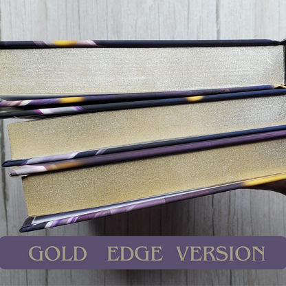 Hardback books of Bend Her, Break Her, and Make Her by Cassie Alexander. Showing gold sprayed edges.