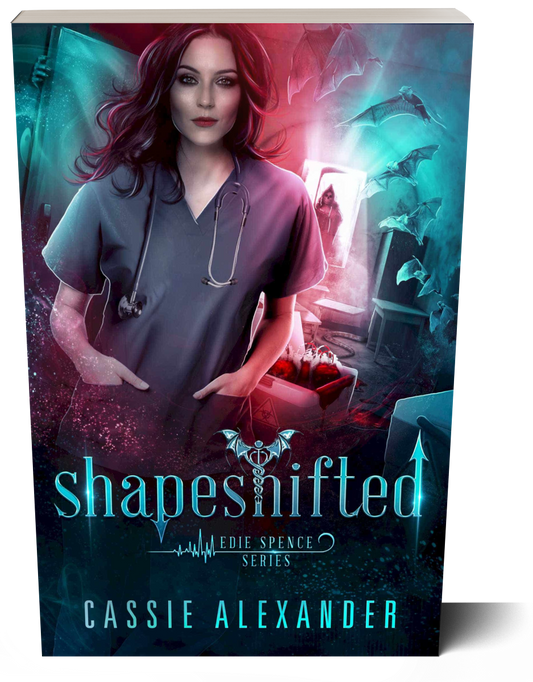 Cover for Shapeshifted: Edie Spence Series Book 3 by Cassie Alexander. A young white woman with shoulder-length brown hair wearing a nurse uniform stands in a hospital corridor, with bats flying around and blood on the floor. Colors are blue and red. Shows a paperback book.