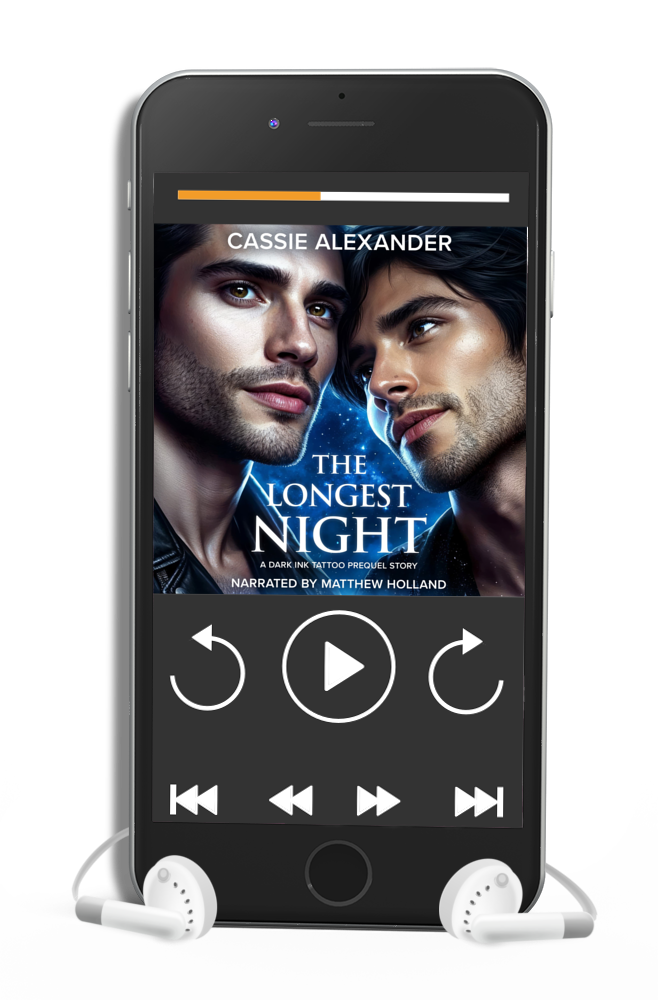 Cover for The Longest Night: A Dark Ink Tattoo Prequel Story by Cassie Alexander, Narrated by Mattew Holland. Jack and Paco gaze at each other against the moonlight. Shows an audiobook on a phone.