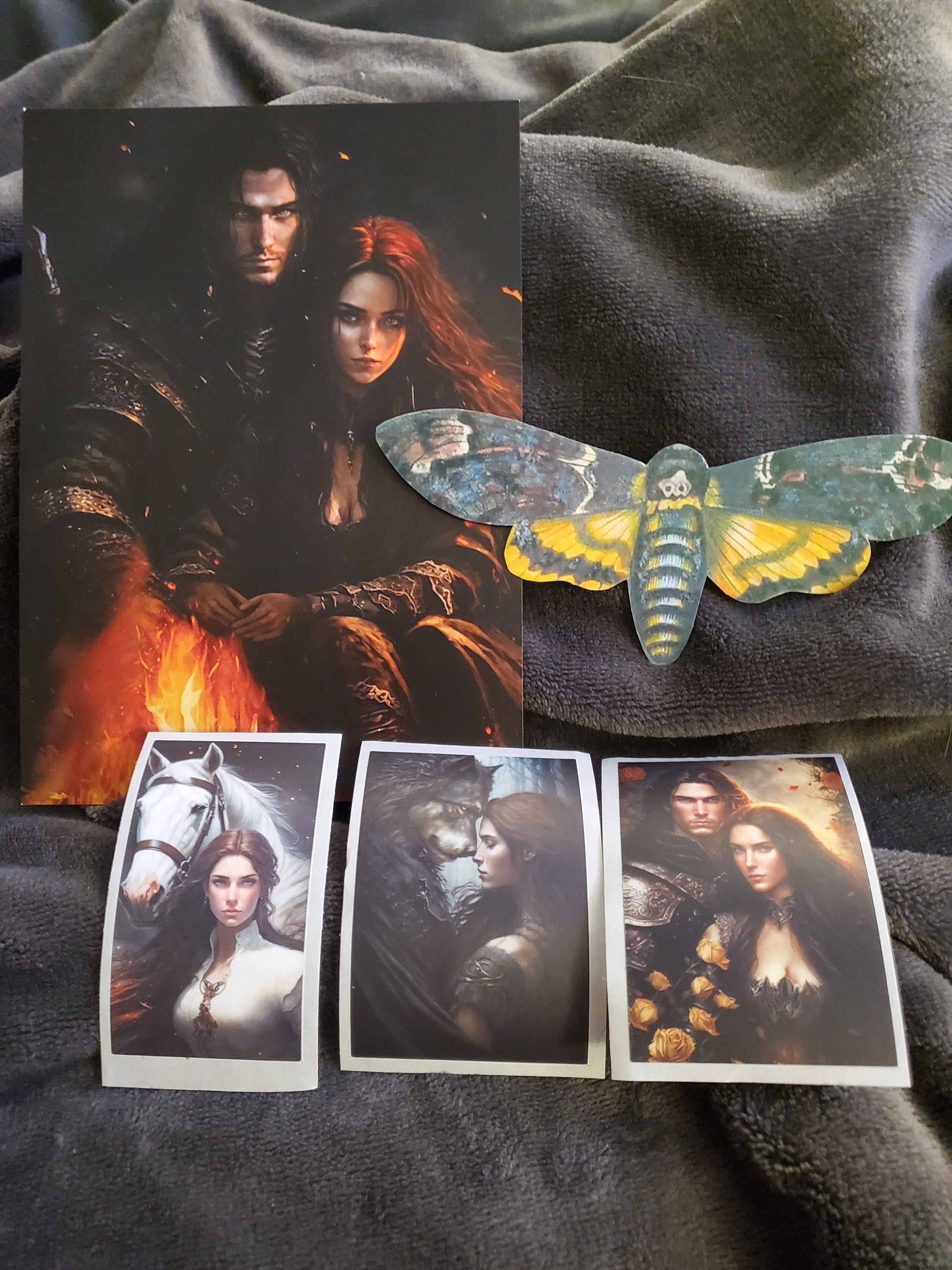 Swag included with Break Her Special Edition. Images show a postcard with Lisane and Rhaim, a moth, and three character images.