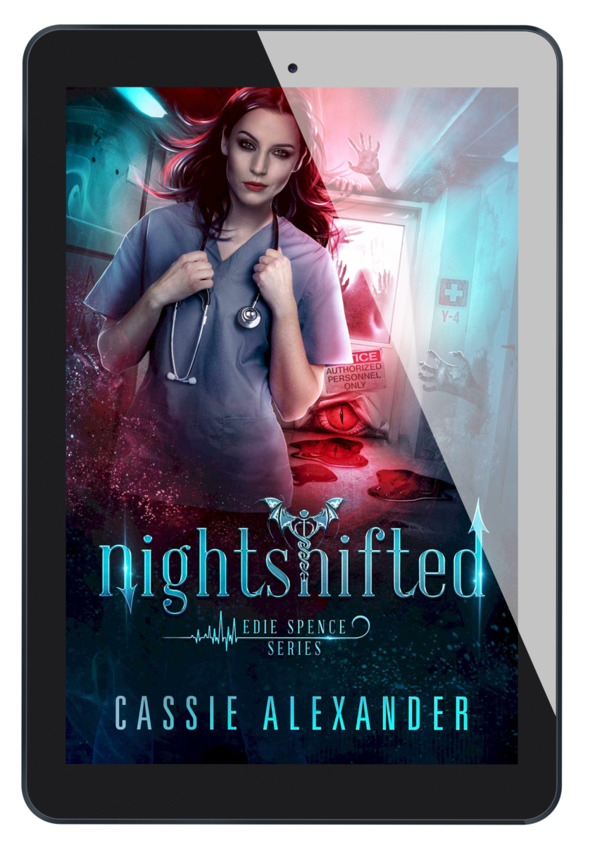 Cover for Nightshifted: Edie Spence Series Book 1 by Cassie Alexander. A young white woman with shoulder-length brown hair wearing a nurse uniform stands in a hospital corridor under supernatural attack. Colors are blue and red. Shows an ebook on a tablet.